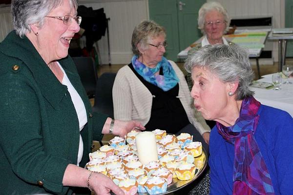4. Sheila Side does the honours and blows out the birthday candle.jpg